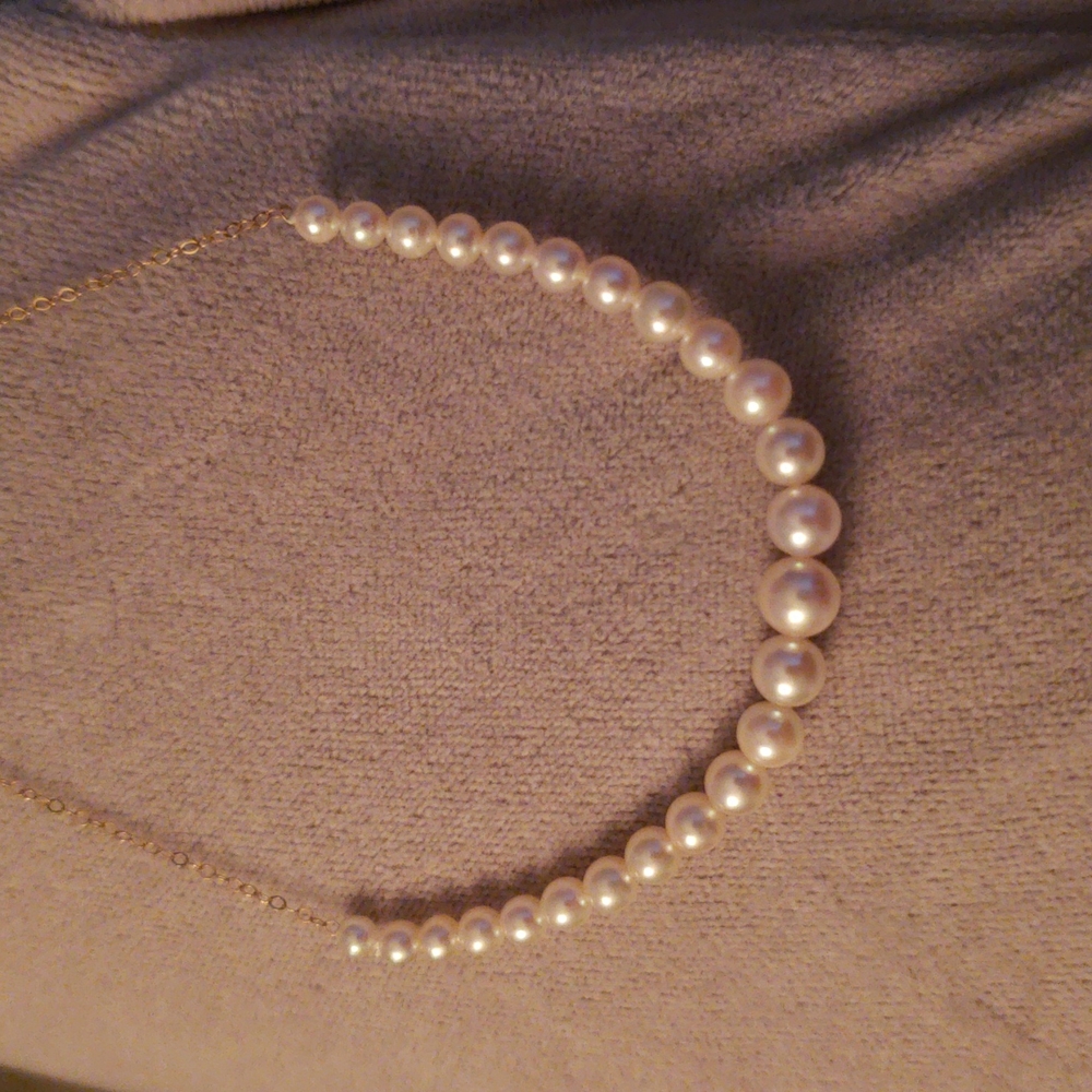 Graduated Pearls (25) necklace on 14k gold chain. From Wilson & Son, Scarsdale.
